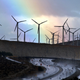 A rainbow forms behind giant windmills in California.
